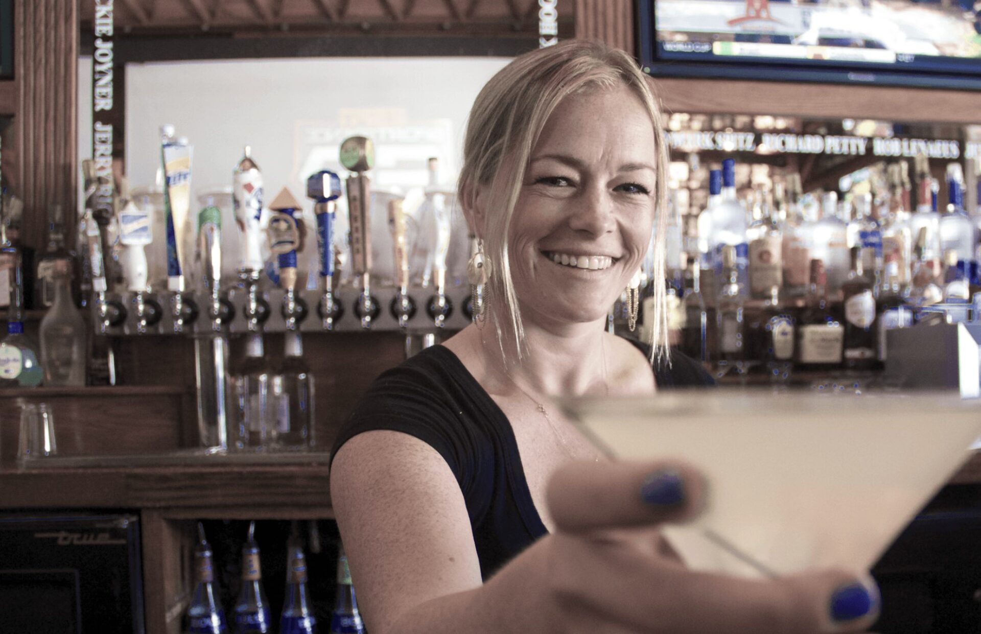 This picture depicts Rebecca Hinderer during her time spent as head bar tender at Legends Sports Bar. Rebecca now owns her own restaurant on Belmont Shore!