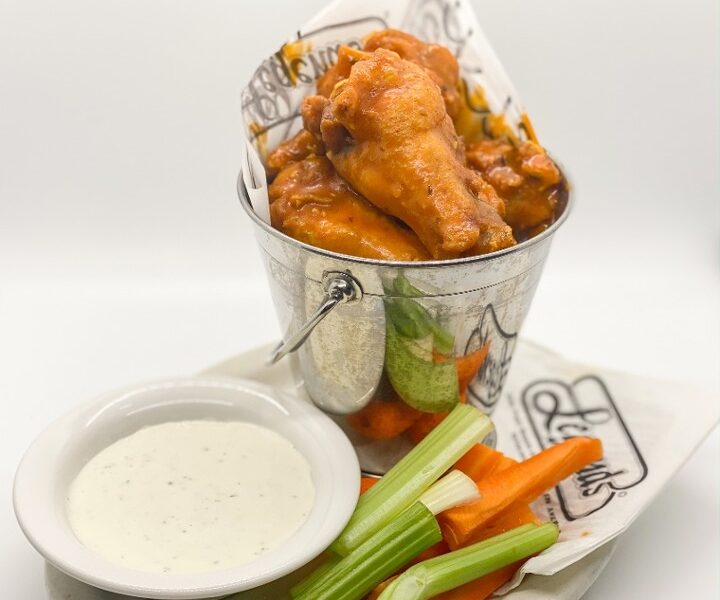 This image depicts a bucket of Legendary Hot Wings that are one of our staple menu items. Servings come in Taster (6pcs), Small (12pcs), Large (24pcs), or Bucket (48pcs)